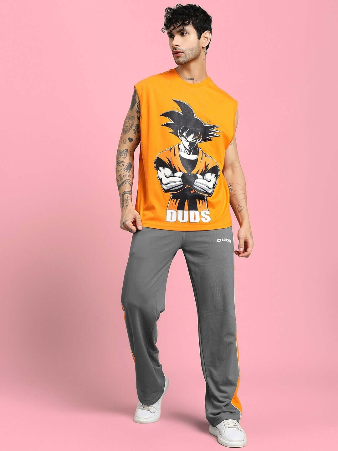 Model wearing SANFORD STRIPE JOGGERS IN GREY with side stripes, modern streetwear look