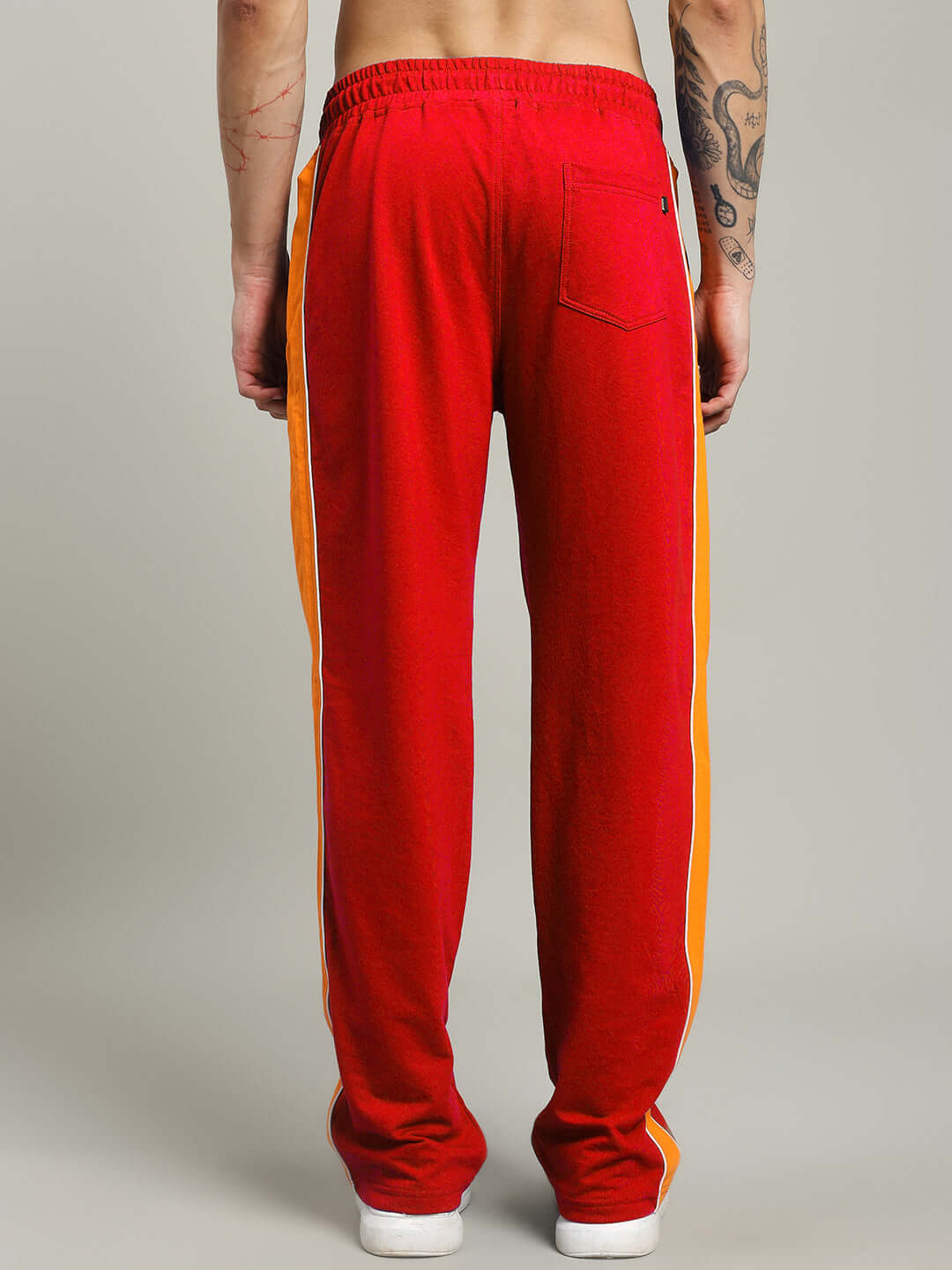 Back view of SANFORD STRIPE JOGGERS IN RED COLOUR with side stripes, crafted for comfort and style in a streetwear design.