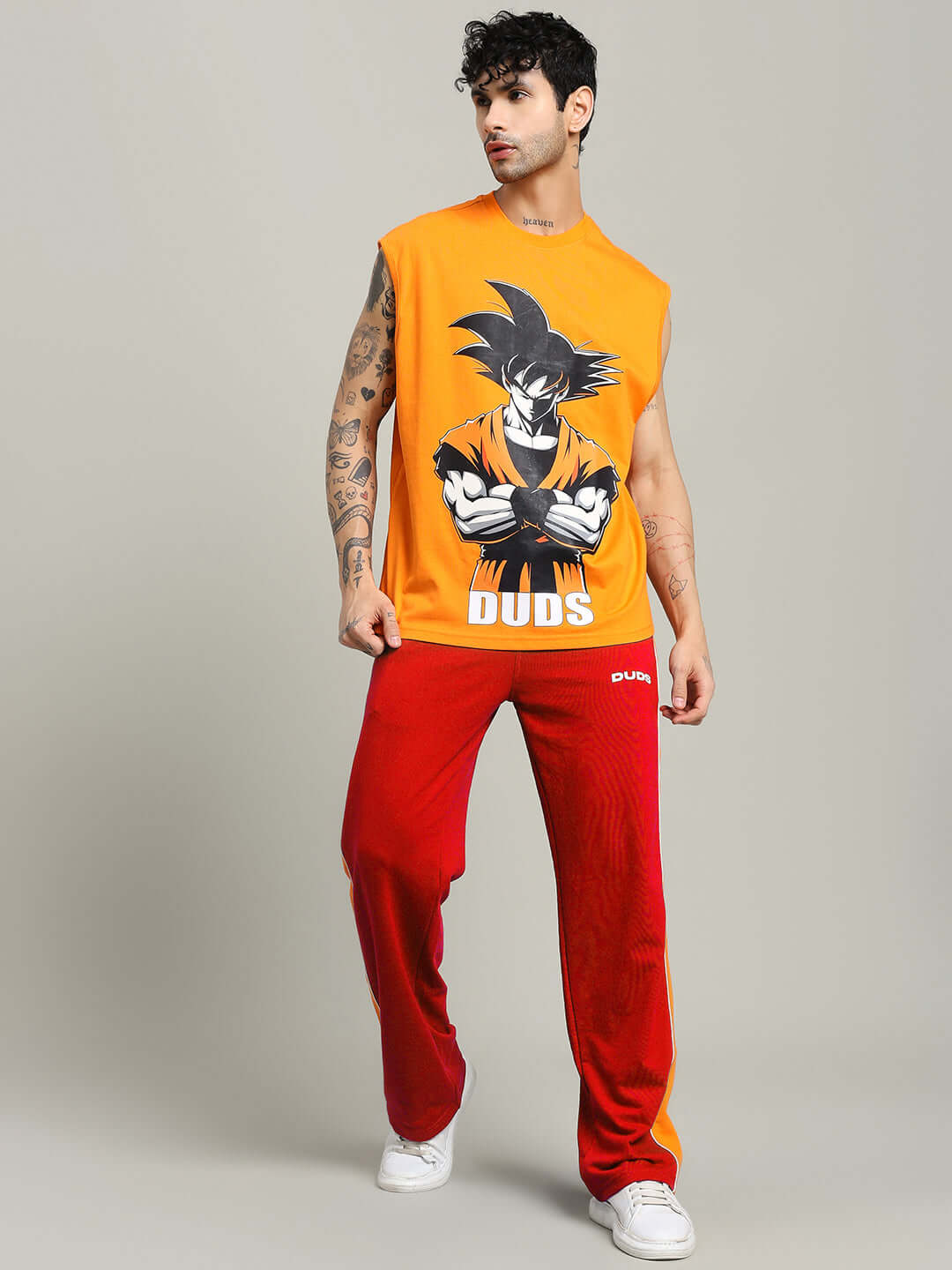 Man wearing SANFORD STRIPE JOGGERS IN RED COLOUR with graphic tee, stylish streetwear fashion