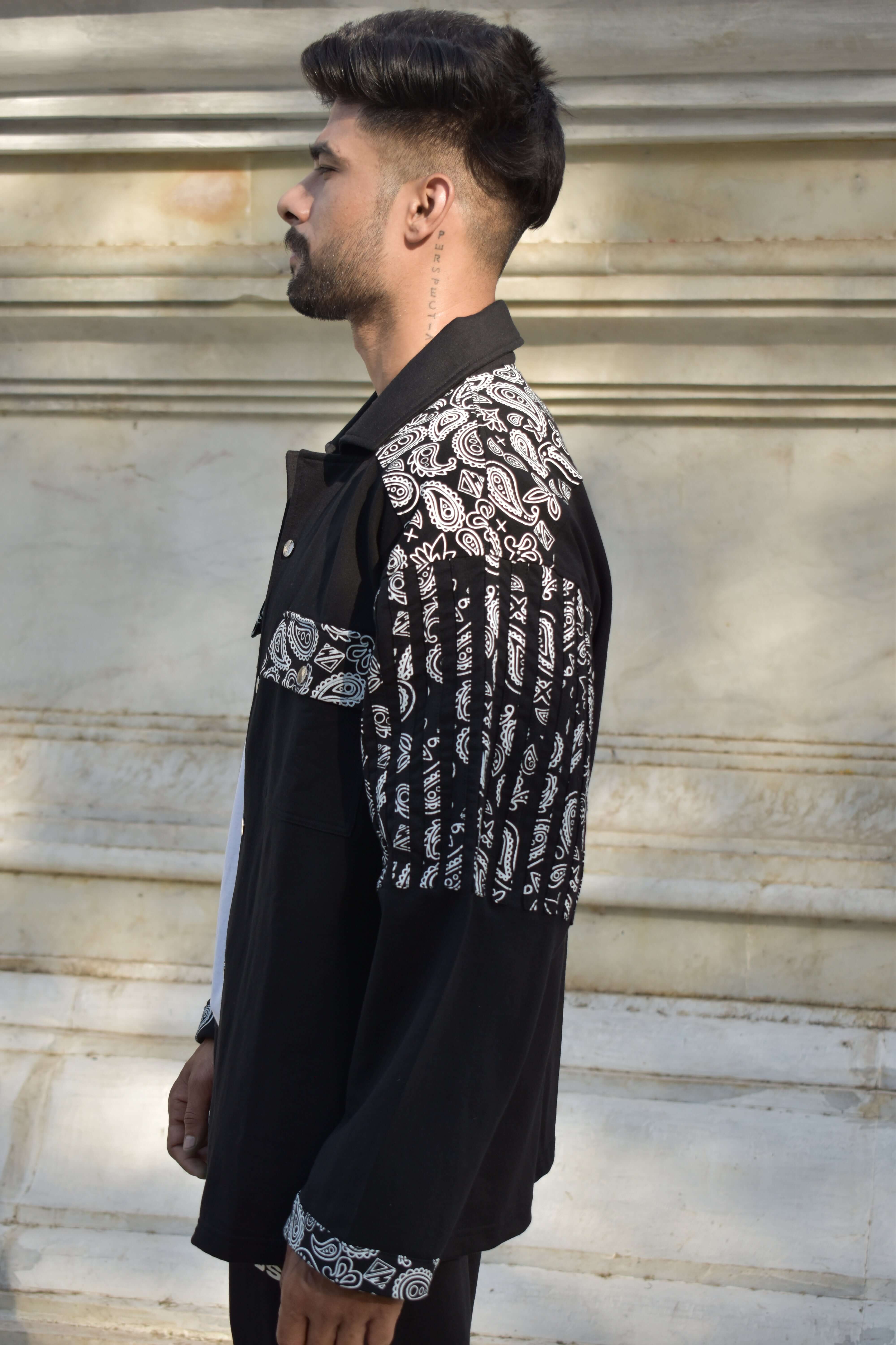 Man wearing a Sanganeri black shirt with intricate white patterns from DUDS; available for custom fit and made-to-order.