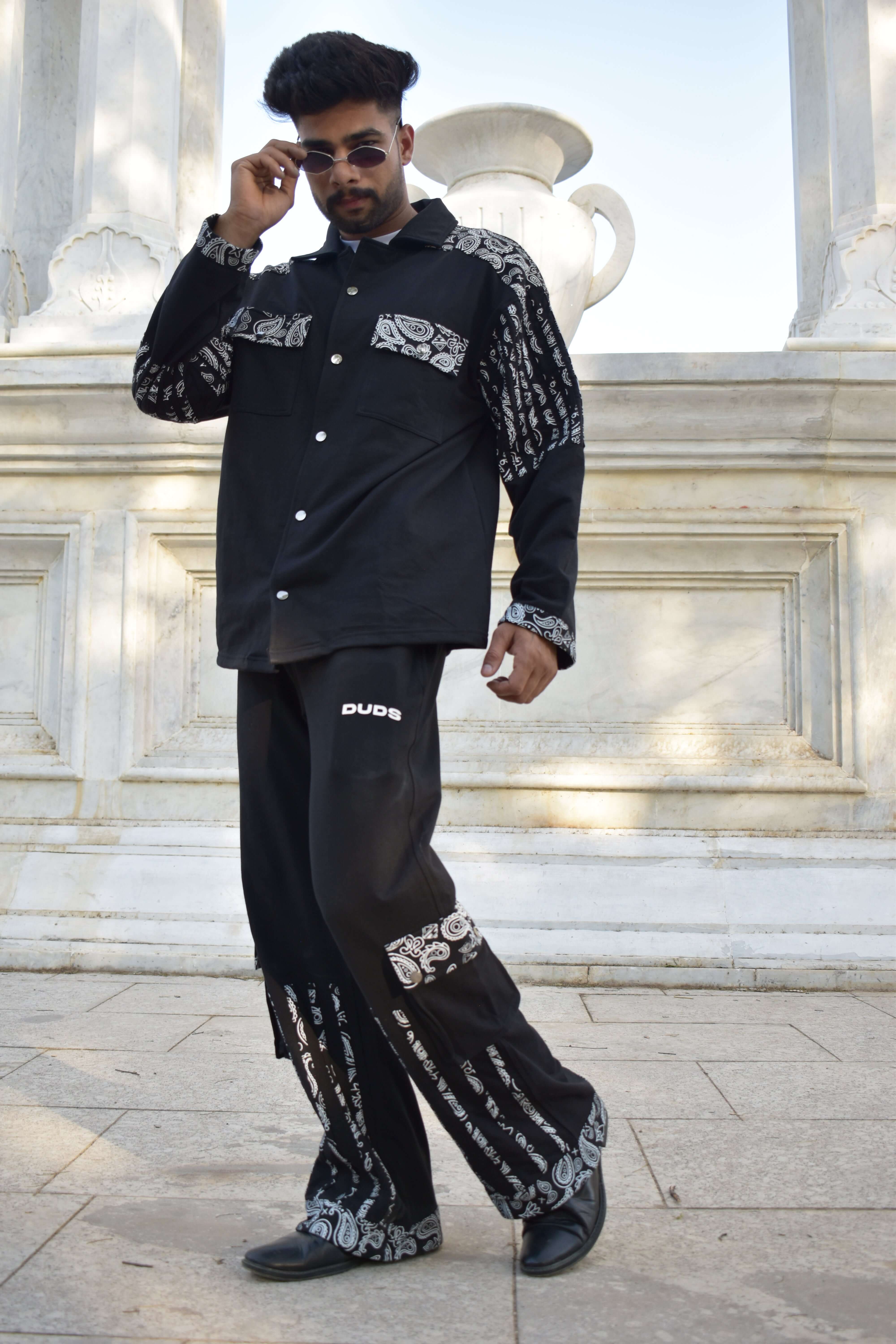 Model wearing a Sanganeri black shirt with intricate patterns, showcasing custom fit options by DUDS.