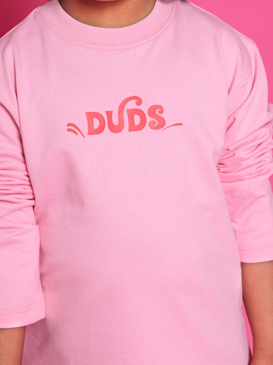 Pink scooter co-ord for boys and girls by DUDS, featuring long sleeves and customized sizing options.