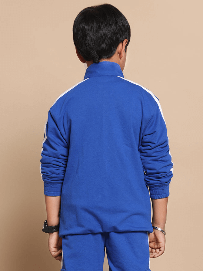 Back view of a child wearing a royal blue SCOTIA jacket, showcasing the design and fit. Ideal for boys and girls, available in custom sizes.