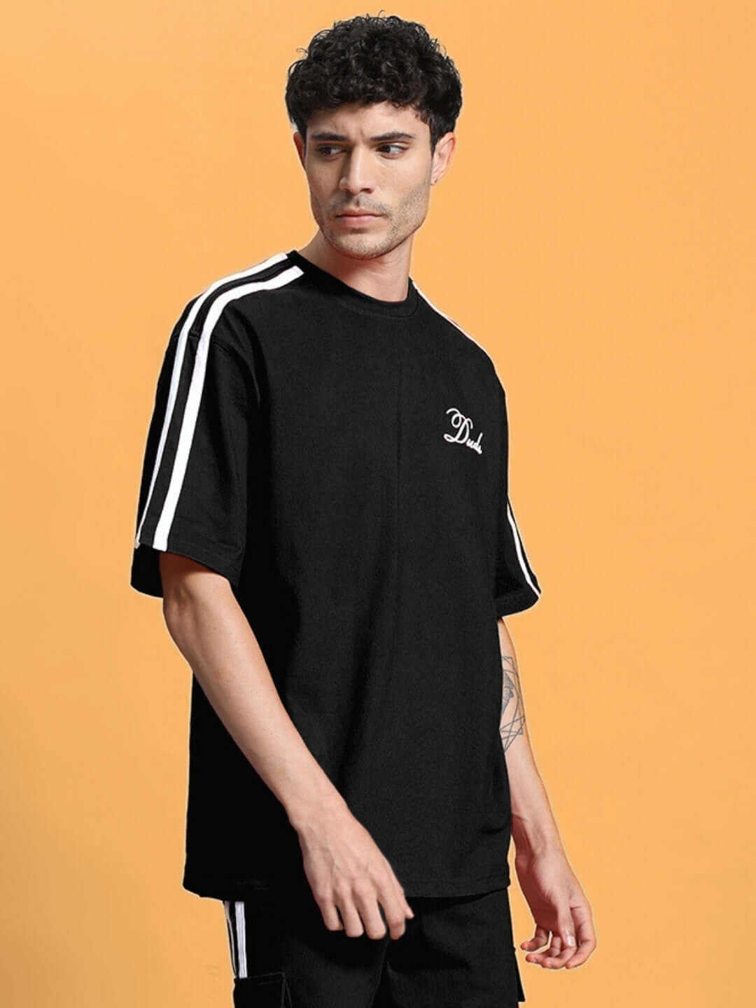 SCOTIA OVER-SIZED T-SHIRT BLACK made from premium heavy gauge fabric with stripe design.