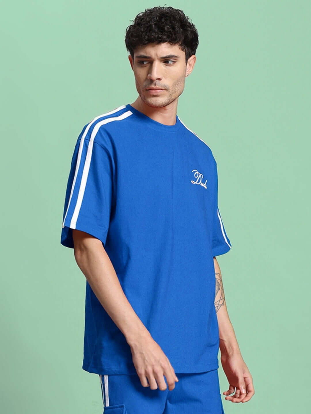 SCOTIA OVER-SIZED T-SHIRT BLUE made of premium cotton fabric, showcased on a model