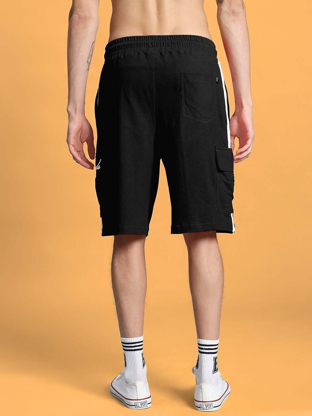 Back view of SCOTIA REGULAR FIT SHORTS BLACK on model showcasing pockets and style ideal for custom fit for comfort and fashion.