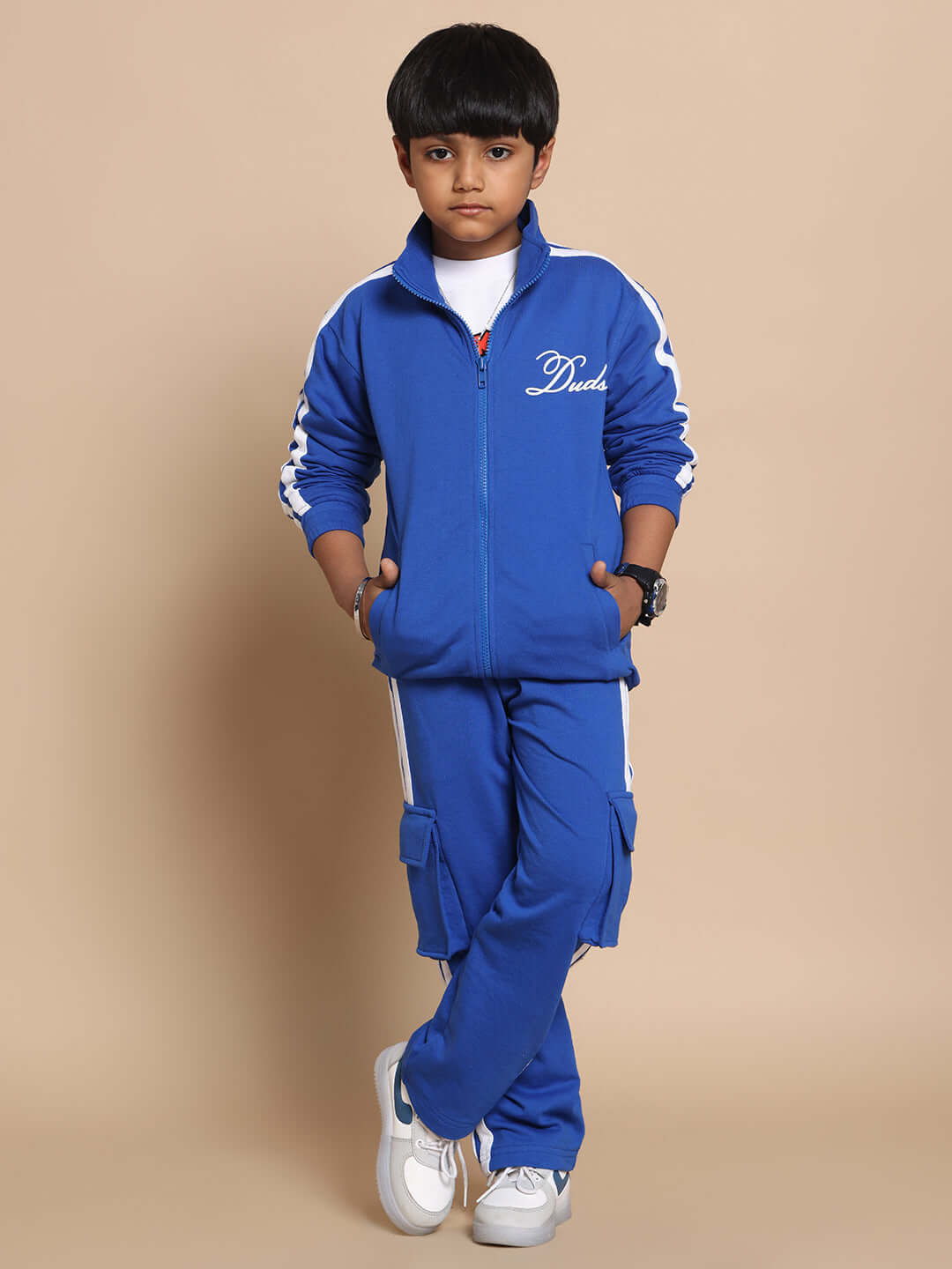 Child wearing Scotia Stripe Joggers in Royal Blue by DUDS, showcasing comfortable fit and stylish design suitable for boys and girls.