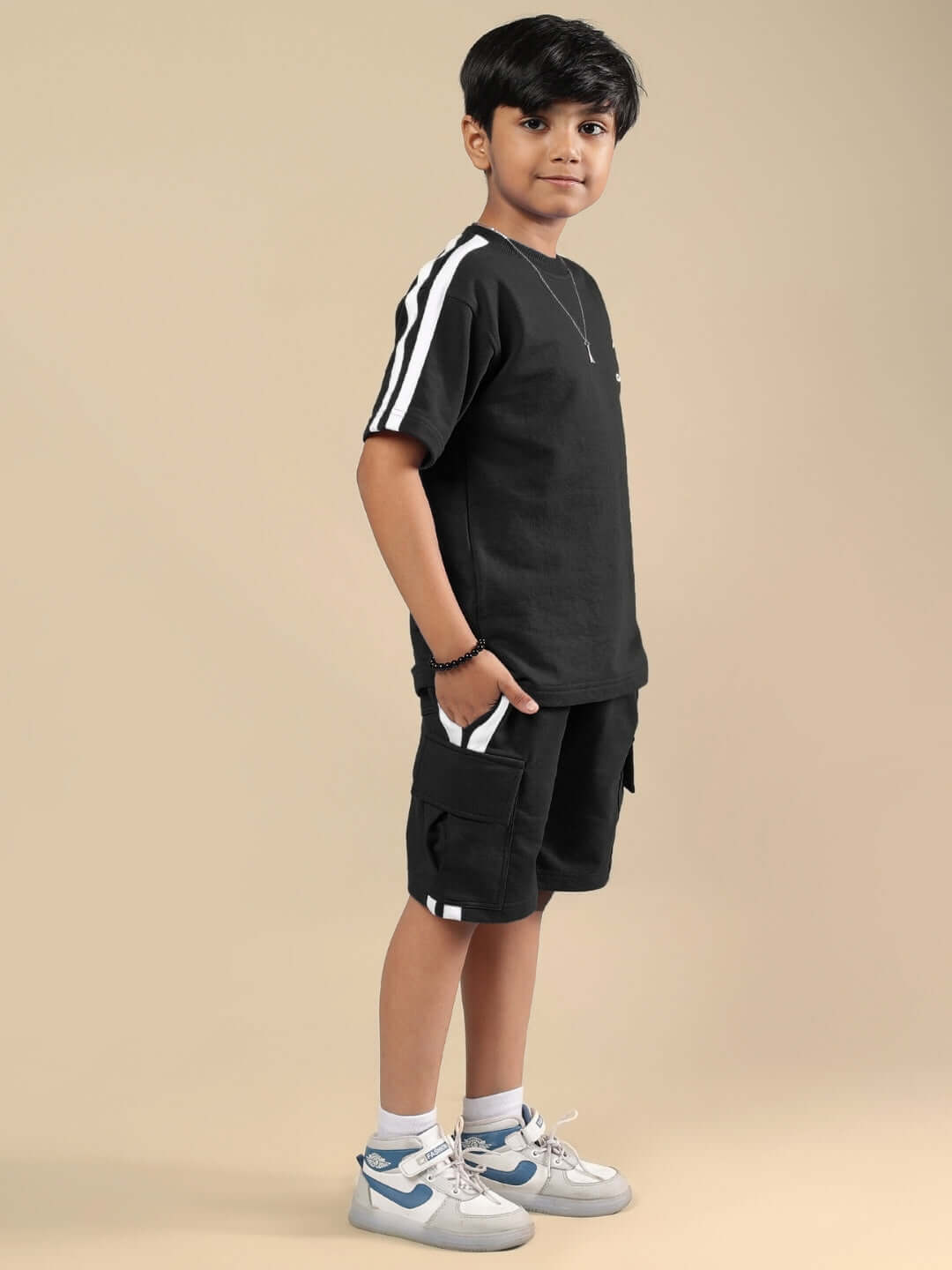SCOTIA SUMMER CO-ORD FOR BOYS & GIRLS BLACK made to order clothing set, featuring a young boy wearing the black co-ord outfit by DUDS.