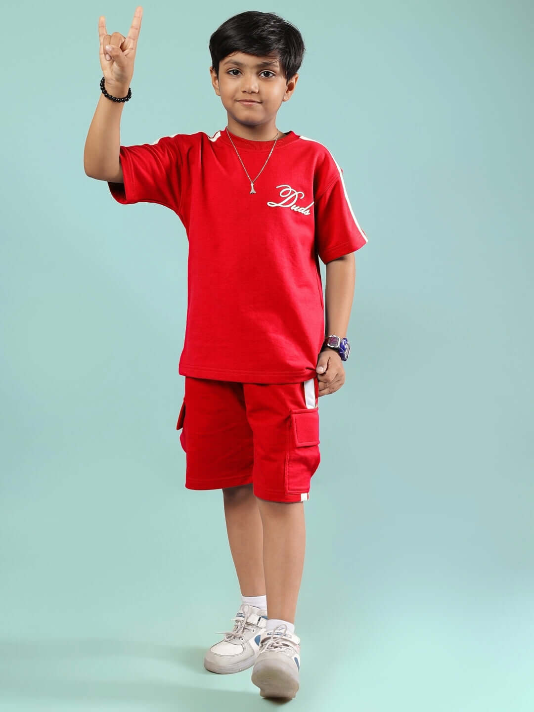Child wearing Scotia Summer Co-Ord for Boys & Girls Red, made of breathable cotton for a stylish and comfortable summer look.