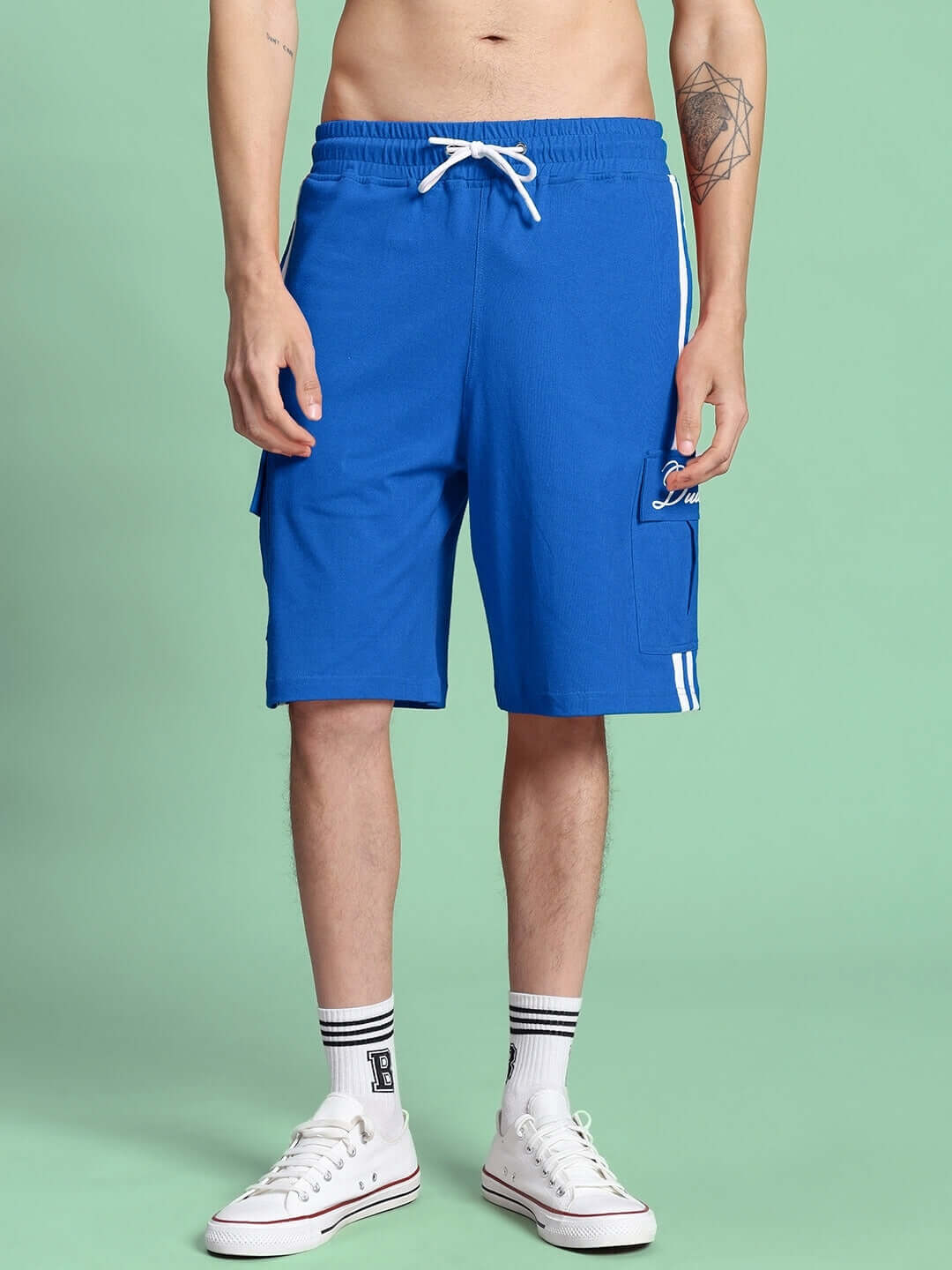 Man wearing SCOTIA SUMMER COTTON TERRY CO-ORD SET BLUE shorts, featuring premium cotton French terry fabric in vibrant blue.
