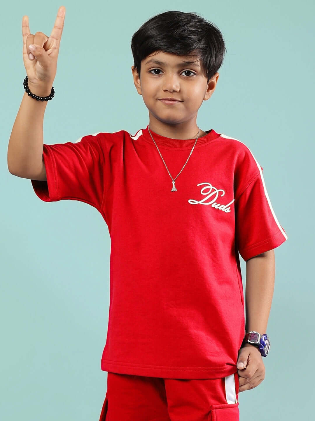 Child wearing SCOTIA T-SHIRT FOR BOYS & GIRLS RED with logo, showcasing style and comfort, ideal for custom fitting.