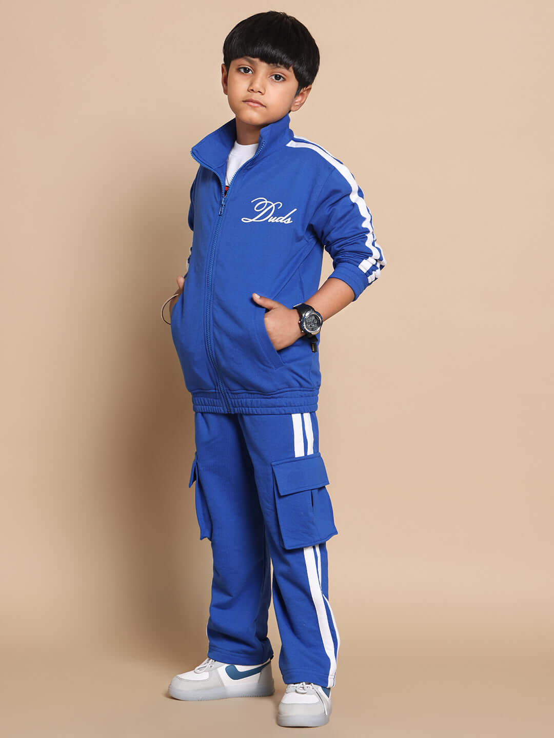 Child wearing a royal blue Scotia Co-Ord Set made of premium cotton terry fabric with front zip and pockets, suitable for boys and girls.
