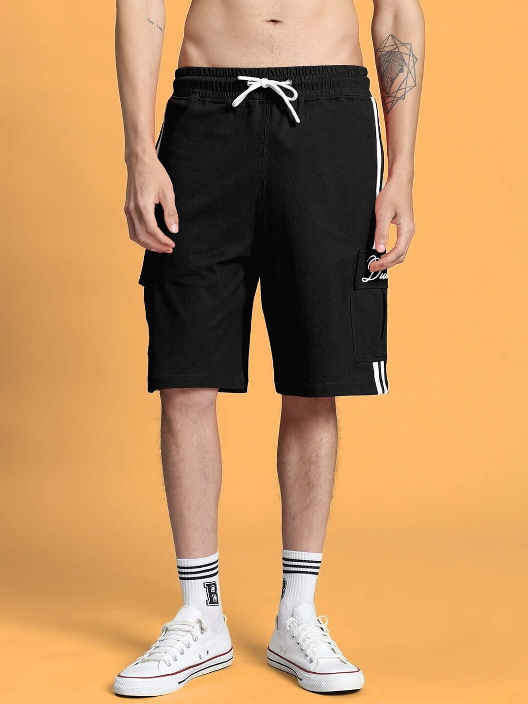 Model wearing SCOTIA REGULAR FIT SHORTS BLACK with drawstring and pockets, showcasing casual fit, custom size option available.
