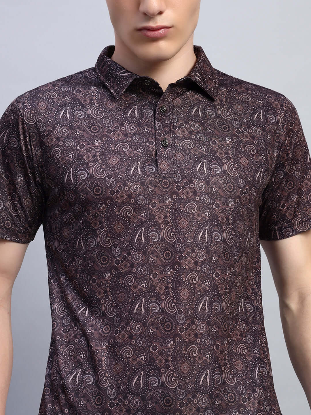 Brown Scottish regular fit t-shirt made from sports polyester fabric, featuring intricate pattern design. Cold machine wash recommended.