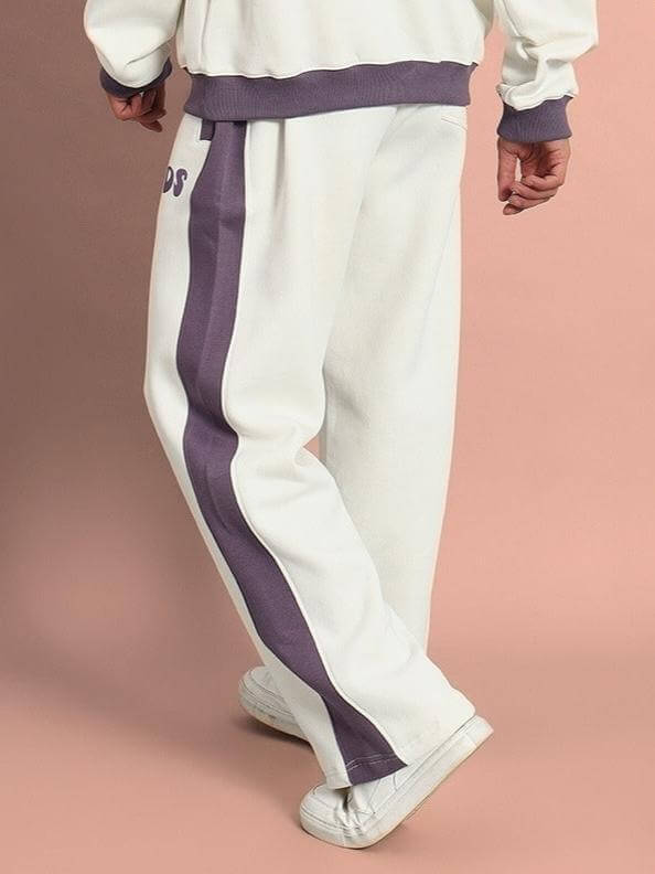 SELF LOVE FLEECE PANT WHITE VIOLET with white base and violet stripe, featuring elastic waistband and ribbed hems for cozy comfort.