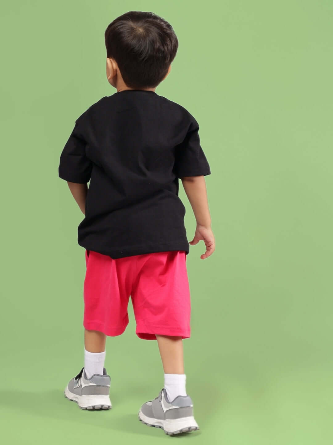 Child wearing SESAME CO-ORD FOR BOYS & GIRLS BLACK-PINK outfit, showcasing a stylish custom fit fashion option.