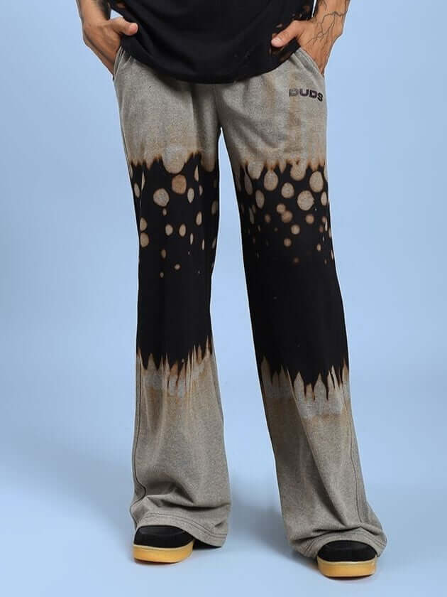 Model wearing SHADOW SWIRL TIE-DYE JOGGER BLACK with unique tie-dye pattern and comfortable athleisure fit, front view.