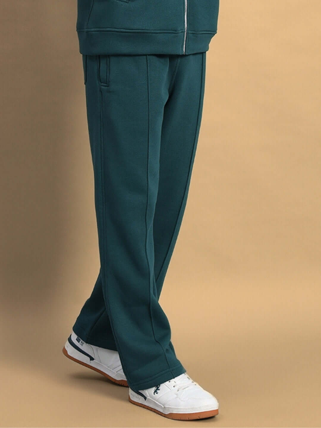 Teal green shaggy fleece jogger pants paired with white sneakers, perfect for stylish comfort and casual wear.