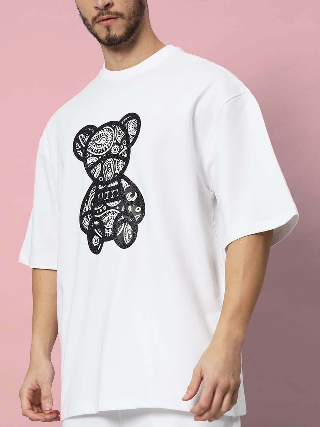 Model wearing white oversized t-shirt with intricate black bear design, premium cotton French terry fabric, 240 GSM, by Color By Colours.