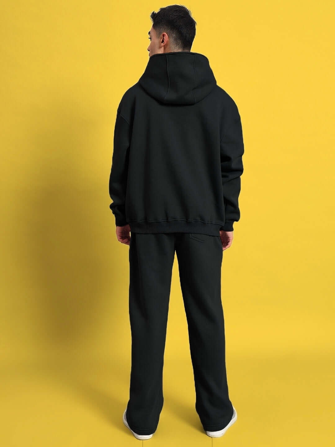 Back view of model wearing WEARDUDS SHOOTER FLEECE CO-ORD BLACK, a custom-fit option available for special orders.