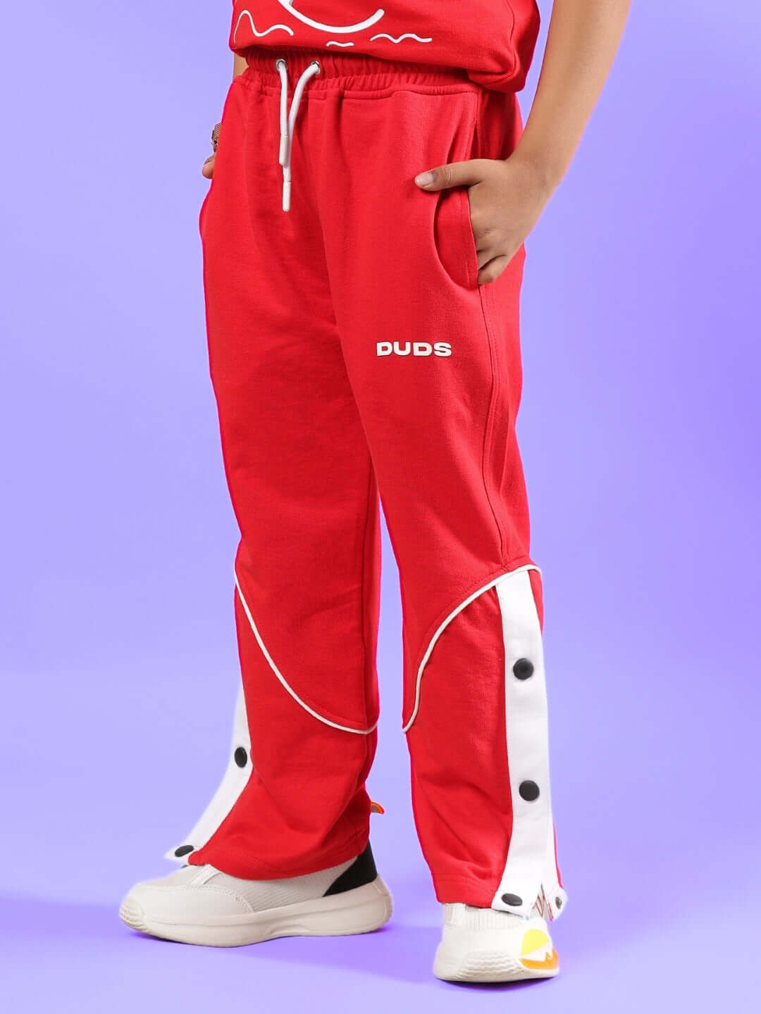 SHORTFIN CO-ORD FOR BOYS & GIRLS RED pants by DUDS, featuring stylish white stripe detail and customizable size for a perfect fit.