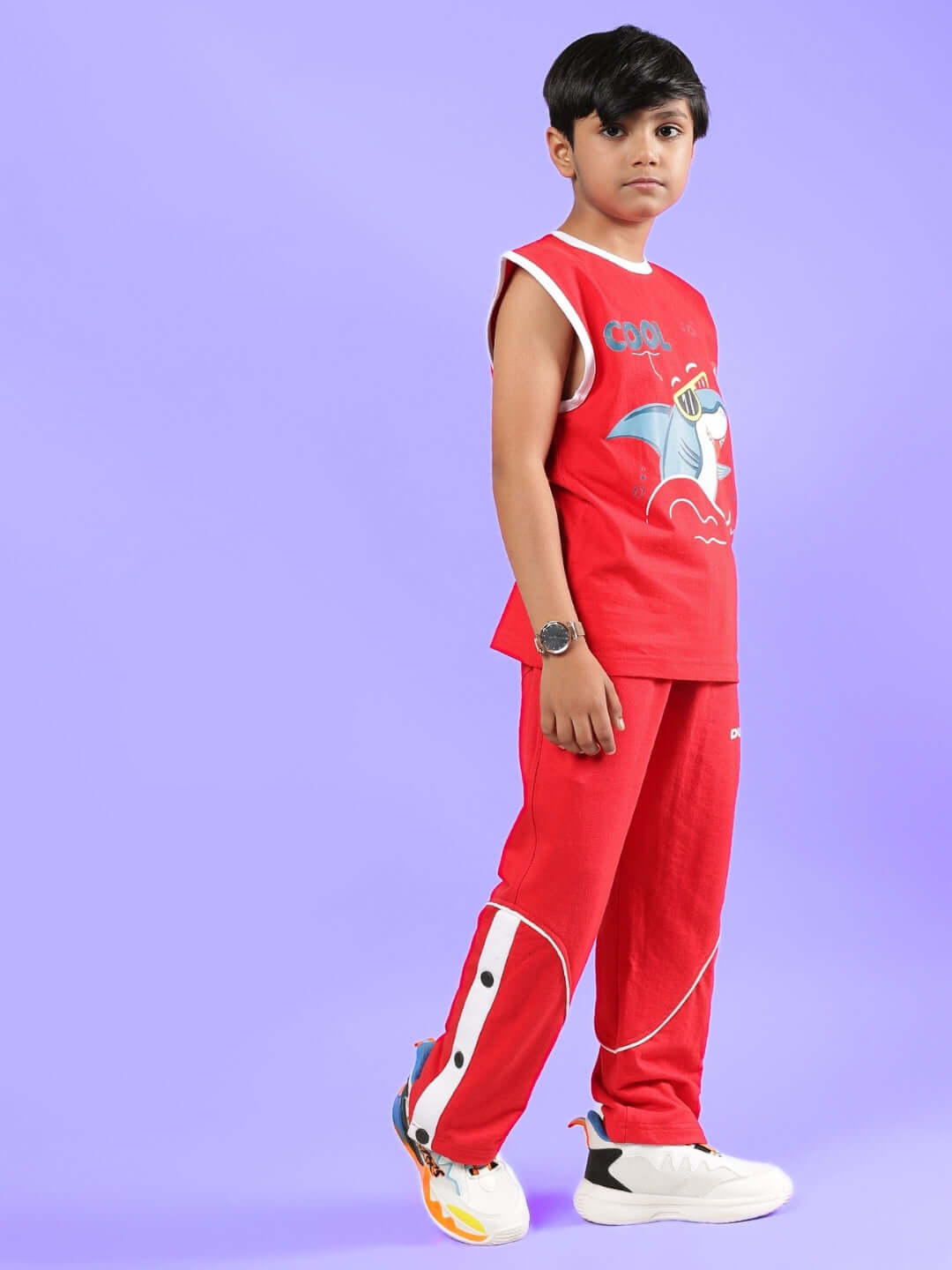 Boy wearing SHORTFIN CO-ORD FOR BOYS & GIRLS RED outfit, featuring a colorful design, perfect for stylish kids. Available in custom fit options.