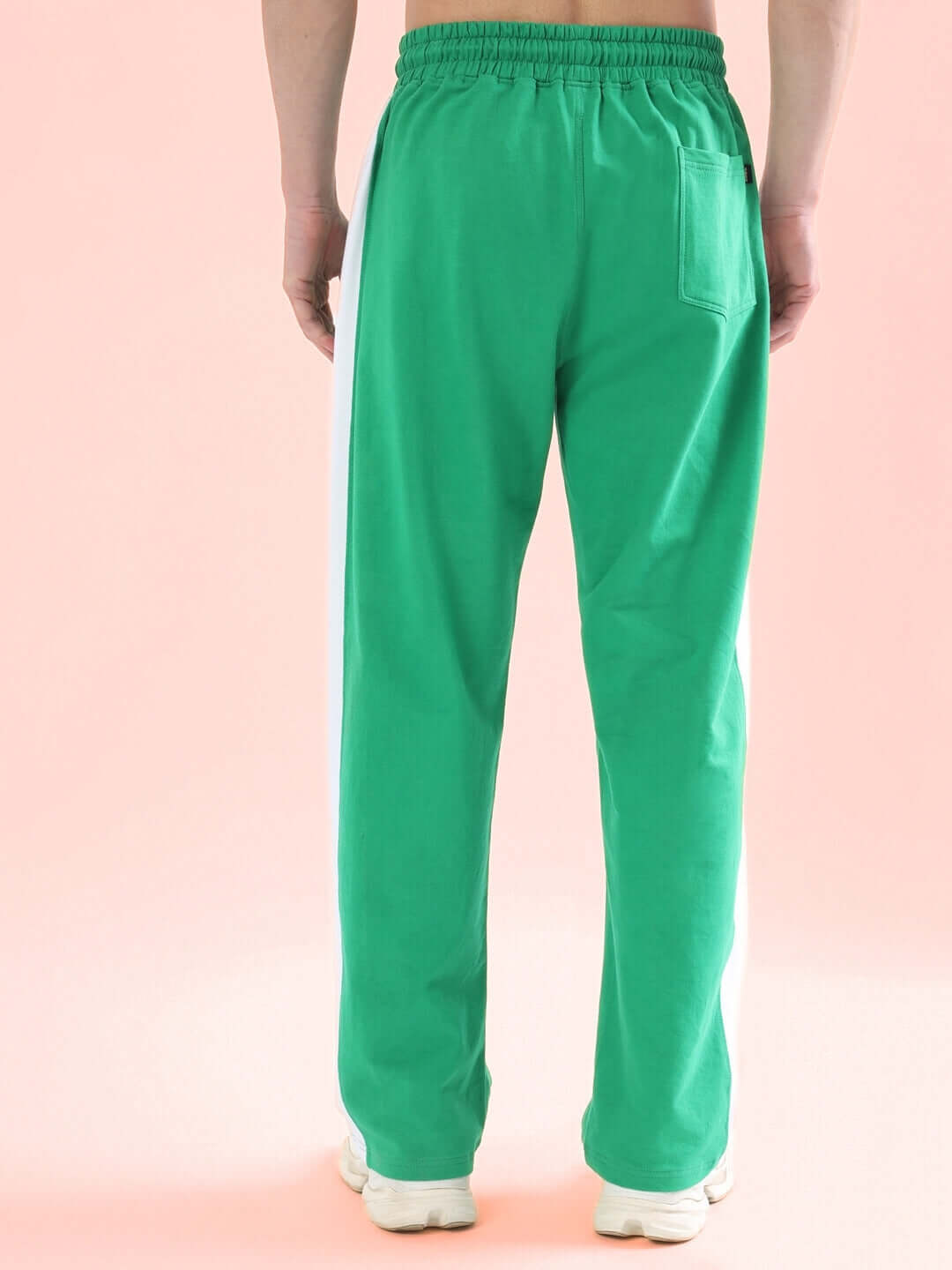 Back view of men's green side seam plated joggers, highlighting elastic waistband and pocket. Perfect for custom fit orders from DUDS.