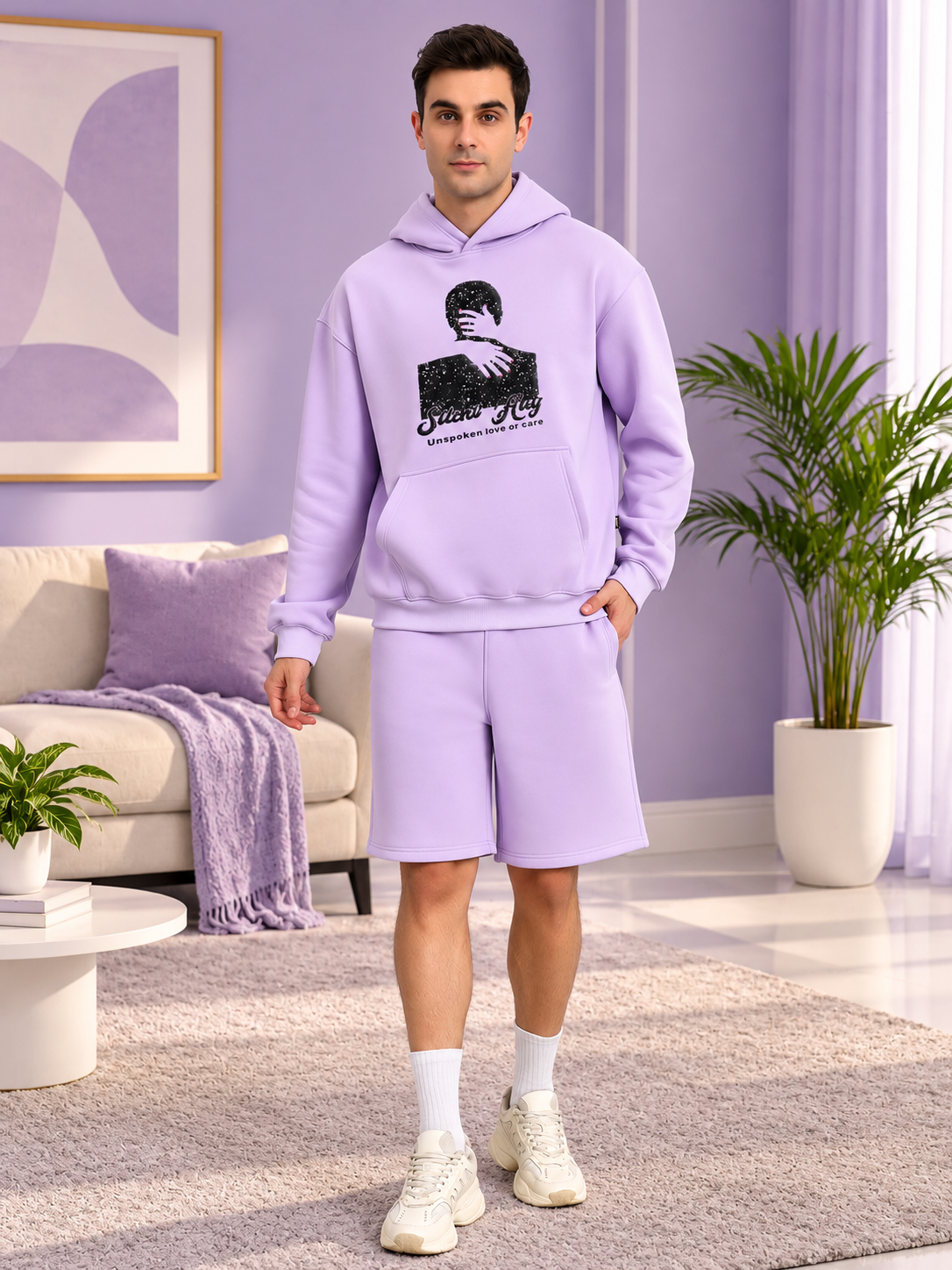 SILENT HUG PRINTED FLEECE CO-ORD LILAC worn by man in cozy living room setting