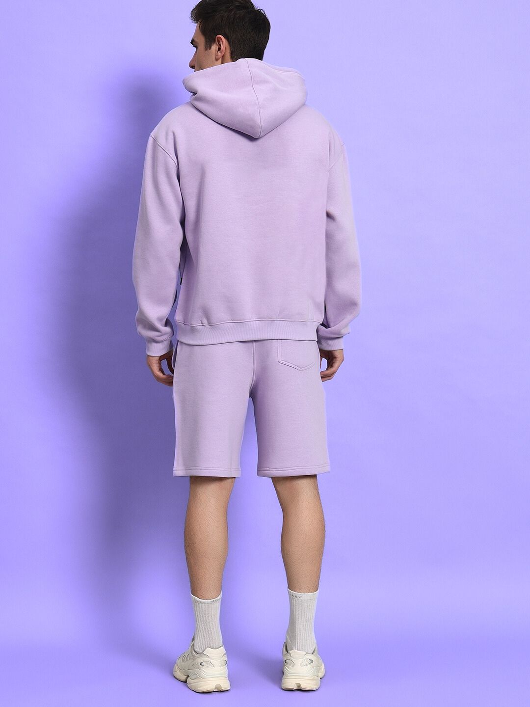 Back view of SILENT HUG PRINTED FLEECE CO-ORD LILAC in lilac tone, showcasing hoodie and shorts set for a modern, bold streetwear look.