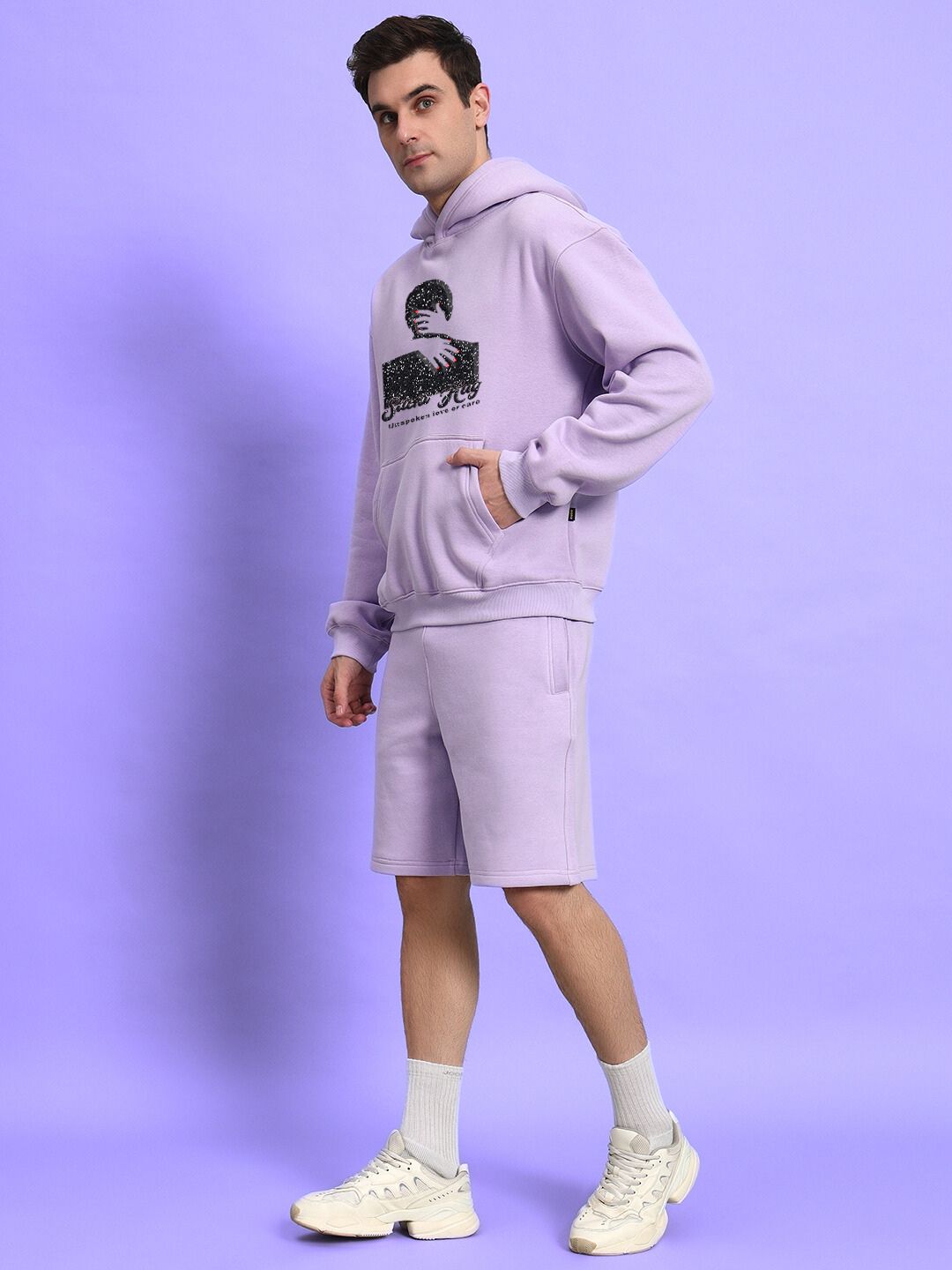 Model wearing SILENT HUG PRINTED FLEECE CO-ORD LILAC with artistic print in lilac tone