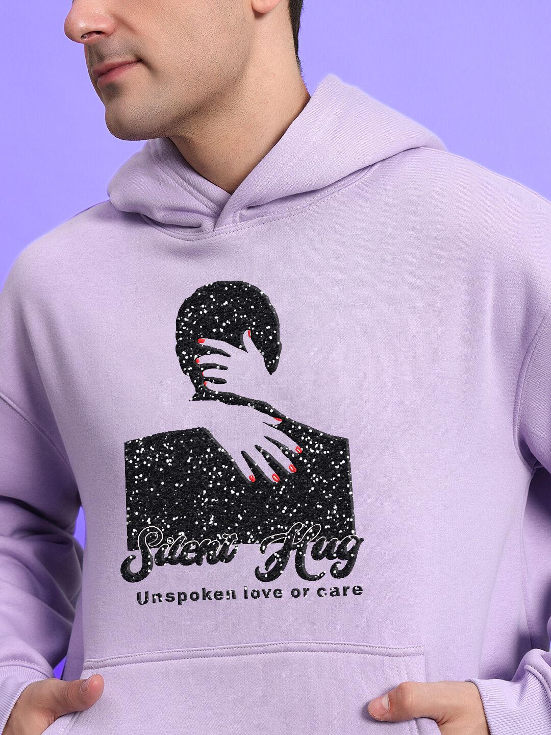 Man wearing SILENT HUG PRINTED FLEECE CO-ORD LILAC hoodie with artistic print, showcasing modern streetwear style in soft lilac color.