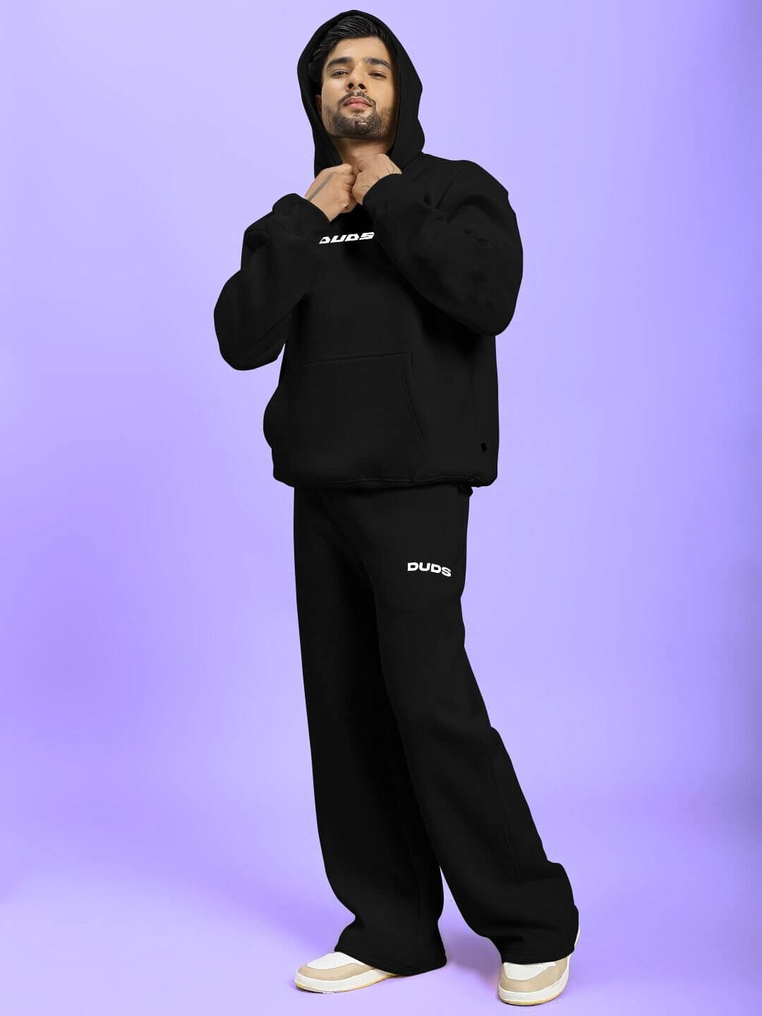 Man wearing SILVER SURFER FLEECE CO-ORD SET BLACK on a purple background.