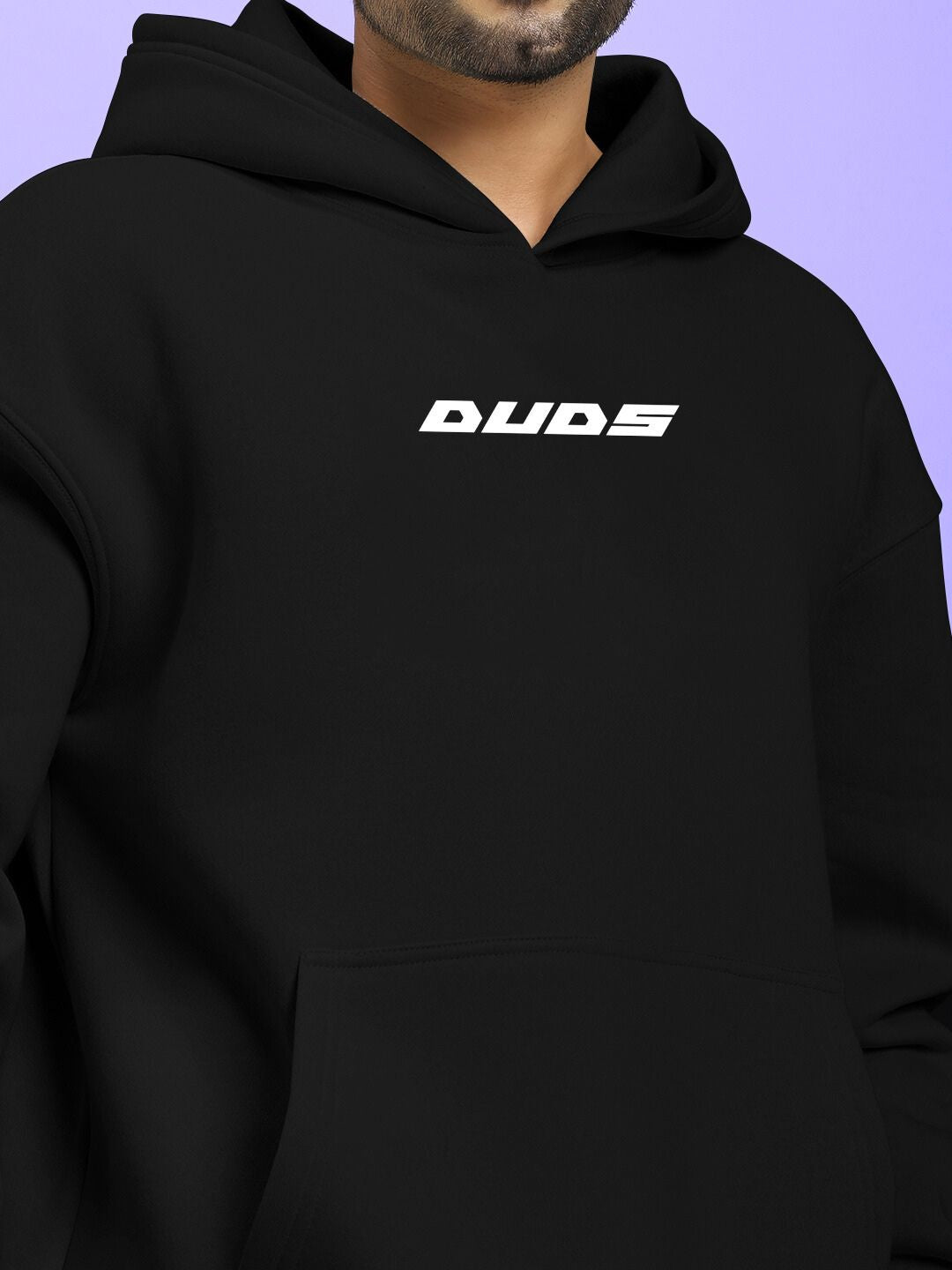 Model wearing SILVER SURFER FLEECE CO-ORD SET BLACK with prominent DUDS logo on the hoodie.