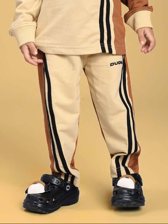 Child wearing SKATER KOREAN JOGGER FOR BOYS AND GIRLS CREAM BROWN featuring street style and East Asian fashion with skater flair.