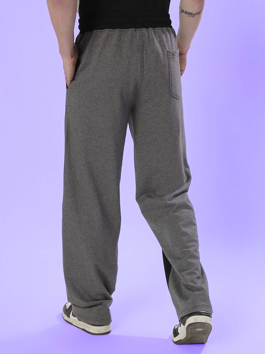 Back view of a person wearing SKATER KOREAN BAGGY JOGGERS in black grey, showcasing casual style and comfort.