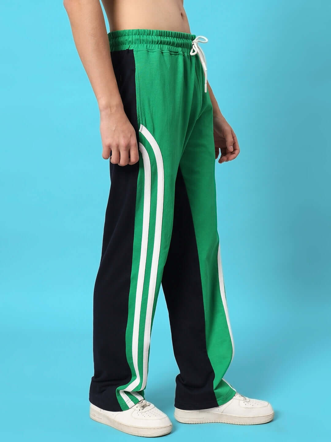 Green and black skater Korean baggy joggers with white stripes, designed for comfortable fit by DUDS, available for custom sizing.