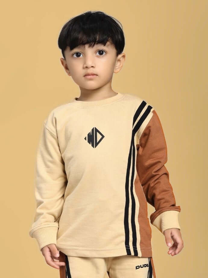 Young child wearing SKATER KOREAN SWEATSHIRT BOYS AND GIRLS CREAM BROWN, featuring trendy stripes and comfortable fit.