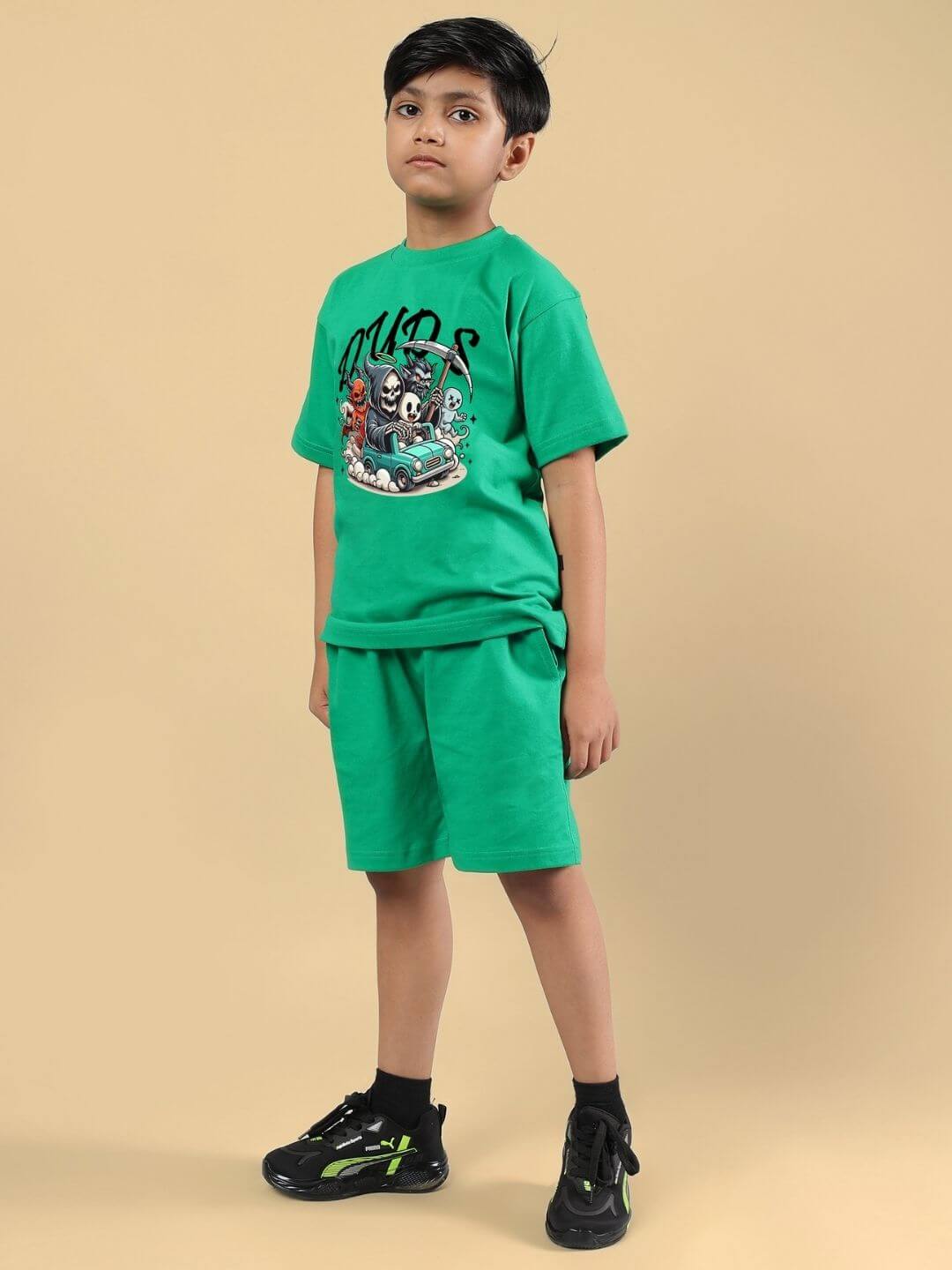 Child wearing green Skeleton Rider Car Print Co-ord set, featuring a bold skeleton car graphic, suitable for boys and girls.