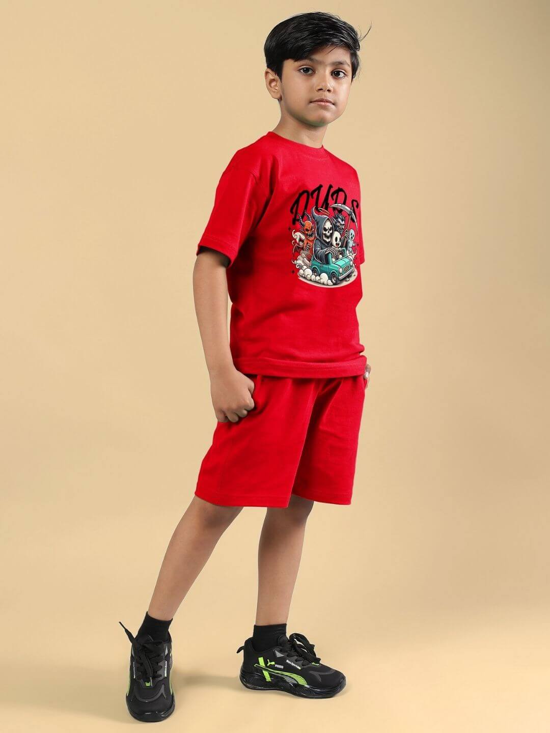 Boy wearing red Skeleton Rider Car Print co-ord set, featuring a graphic T-shirt and shorts, ideal for stylish kids' fashion.