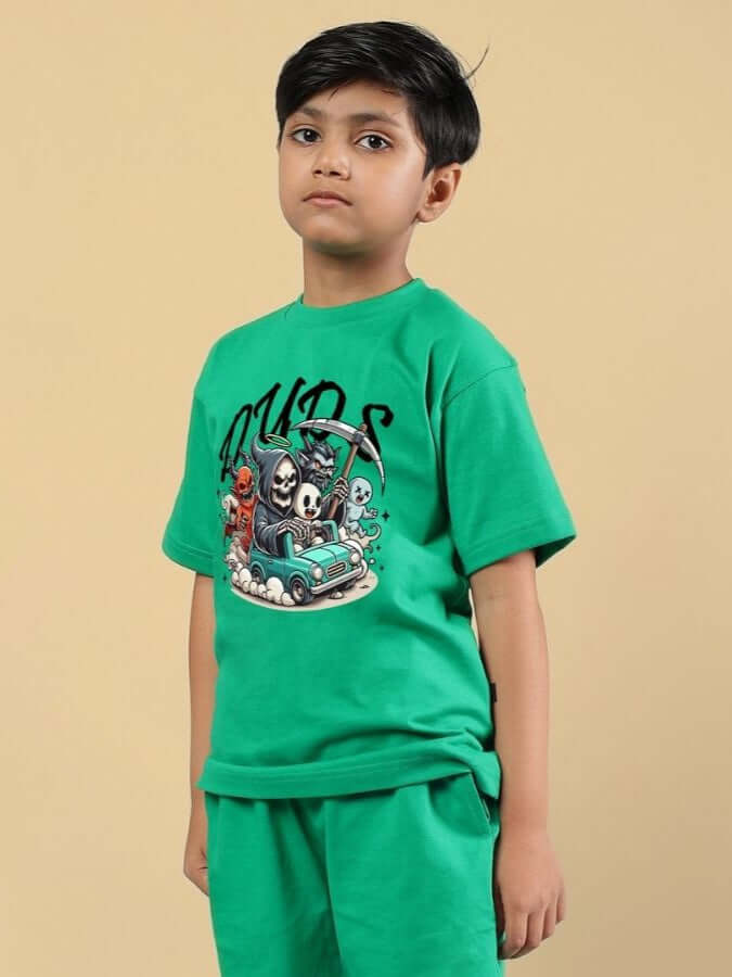 Child wearing SKELETON RIDER CAR PRINT T-SHIRT FOR BOYS AND GIRLS GREEN, featuring a bold skeleton car design.