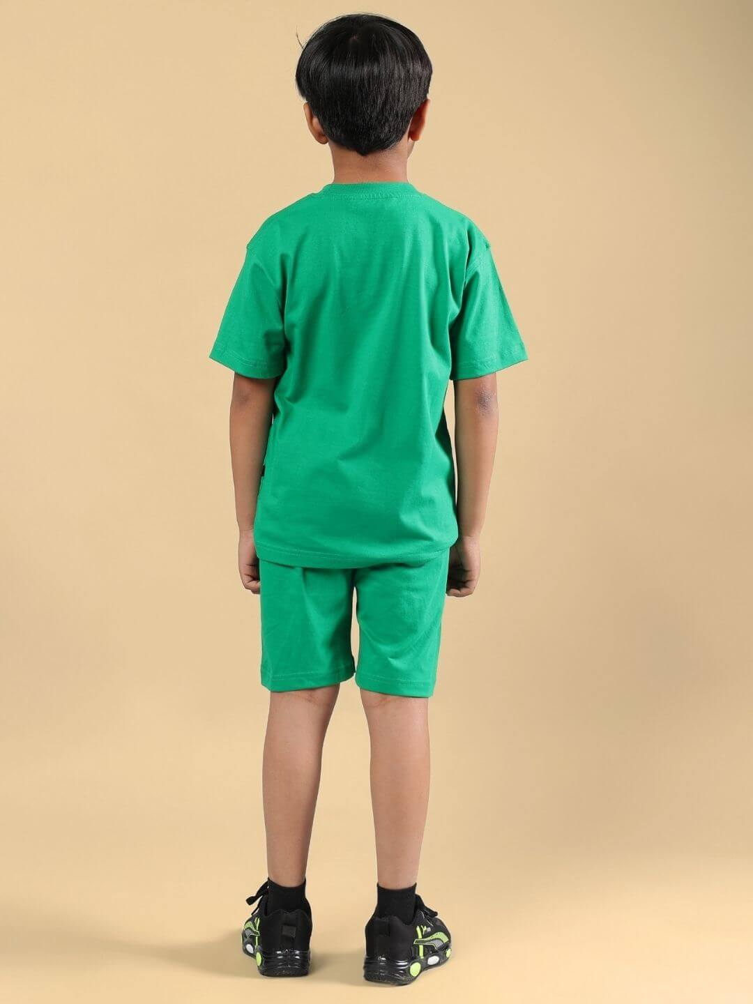 Back view of a child wearing a green Skeleton Rider Car Print co-ord set for boys and girls, showcasing a stylish and comfortable fit.
