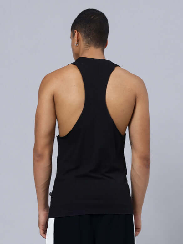 Back view of model wearing SKELETOR PRINTED GYM T-SHIRT BLACK, showcasing gym wear style.