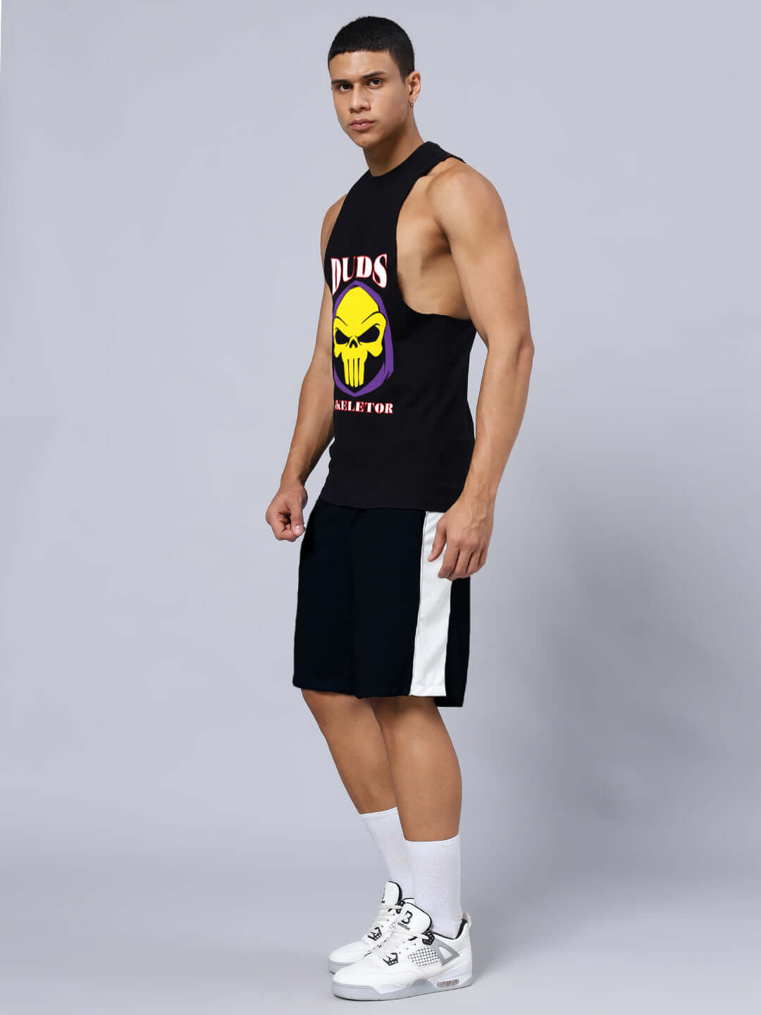 Man wearing SKELETOR GYM CO-ORD SET SELEEVELESS BLACK, featuring premium heavy gauge cotton t-shirt and sports polyester shorts