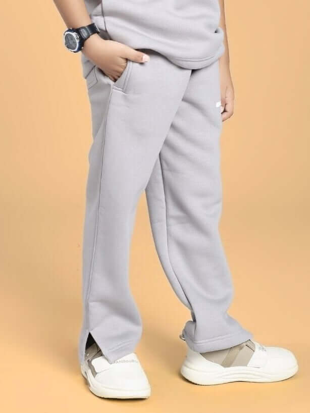 Child wearing SKODA FLEECE JOGGER FOR BOYS AND GIRLS GREY, showing relaxed fit and style.