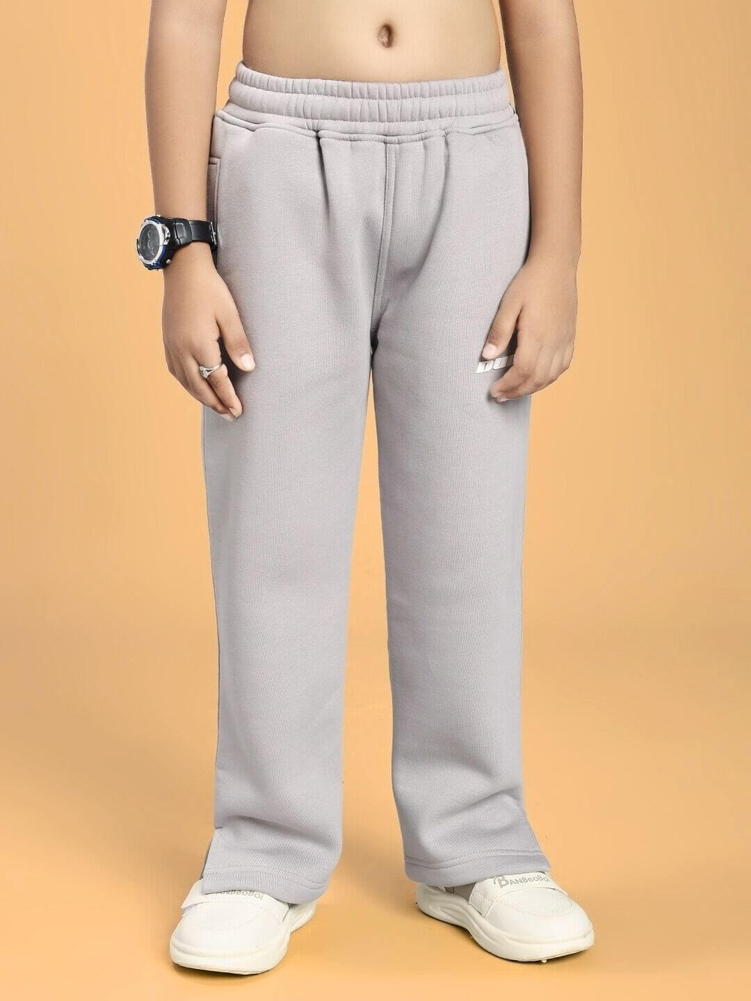 Child wearing SKODA FLEECE JOGGER FOR BOYS AND GIRLS GREY demonstrating cozy style and comfort.