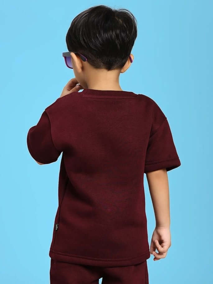 Child wearing a SKODA FLEECE T-SHIRT FOR BOYS AND GIRLS MAROON