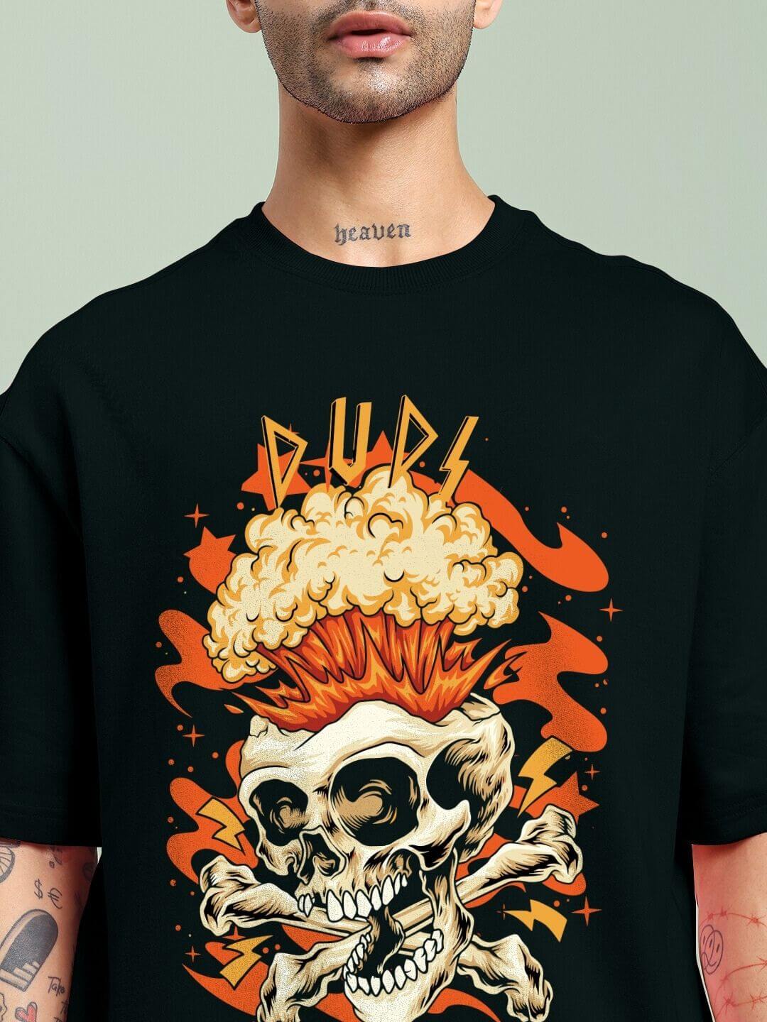 Person wearing a SKULL BLAST FIRE PRINT OVERSIZED T-SHIRT BLACK with fiery skull graphic and artistic design for edgy street fashion.