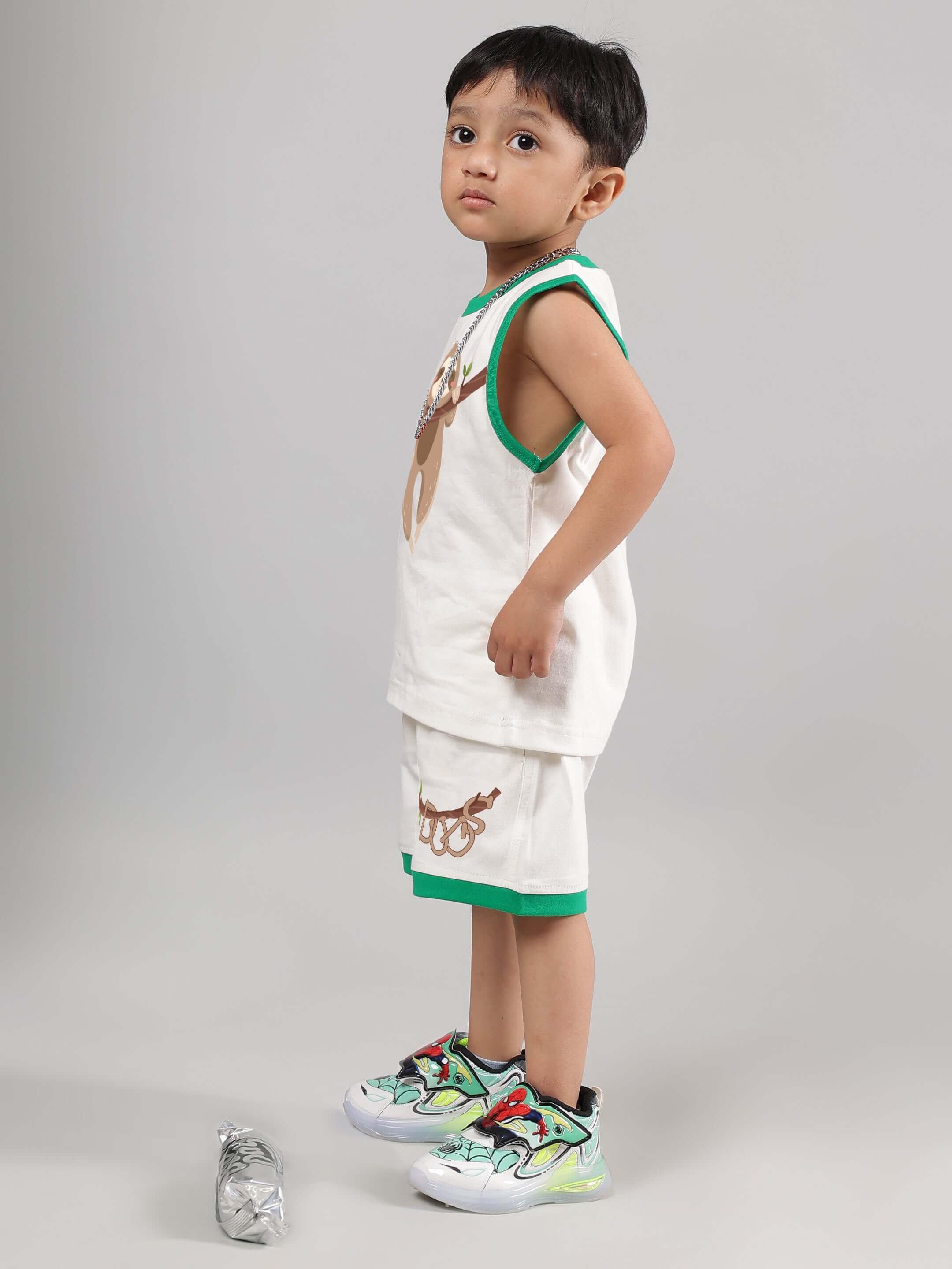 SLOTH CO-ORD FOR BOYS GIRLS OFF WHITE - Child wearing off-white sloth-themed outfit with green accents, perfect for unisex fashion and comfort.