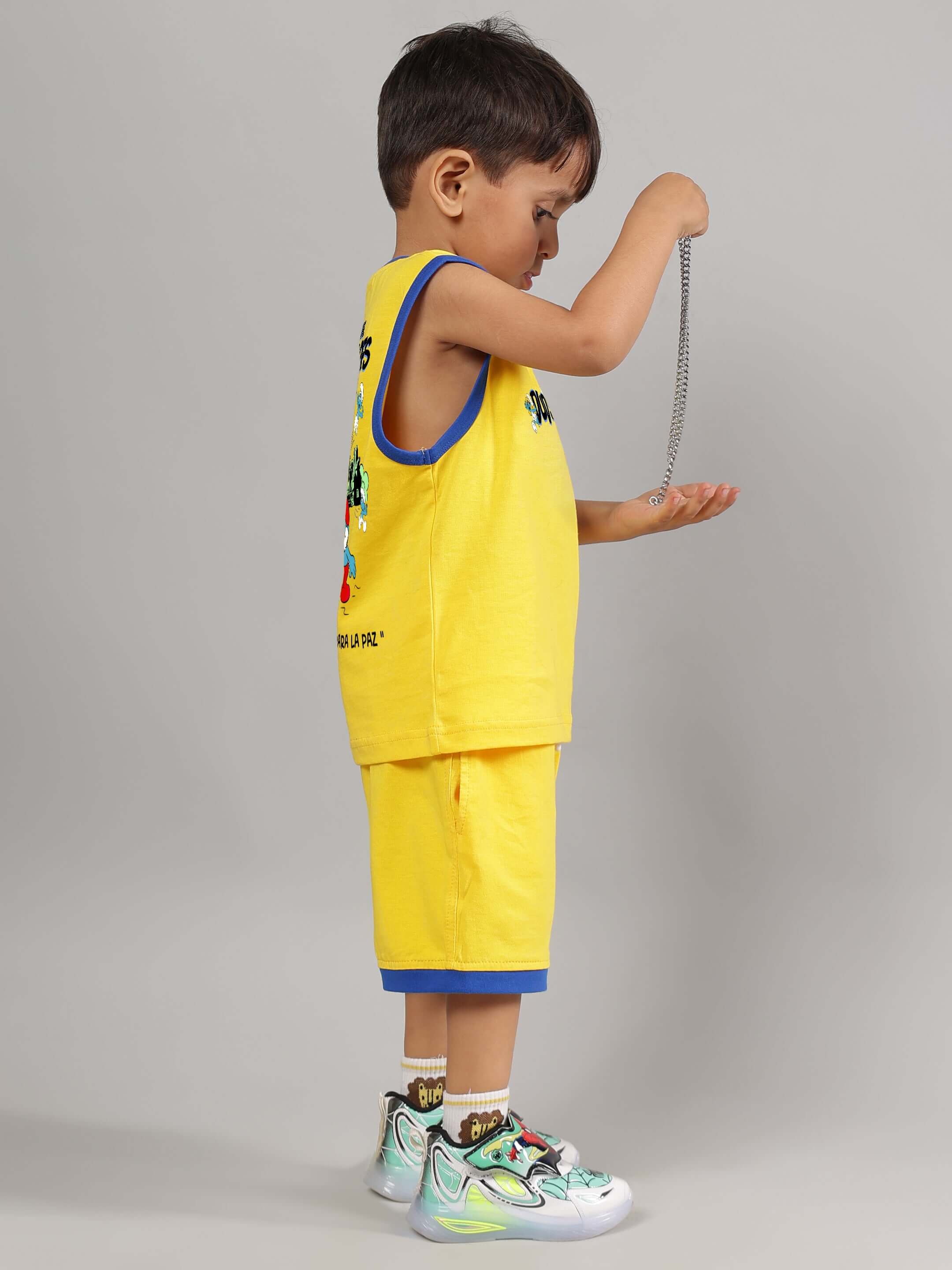 Child wearing SMURFS HOME CO-ORD FOR BOYS GIRLS YELLOW set with playful design, showcasing vibrant colors and comfortable cotton-blend.