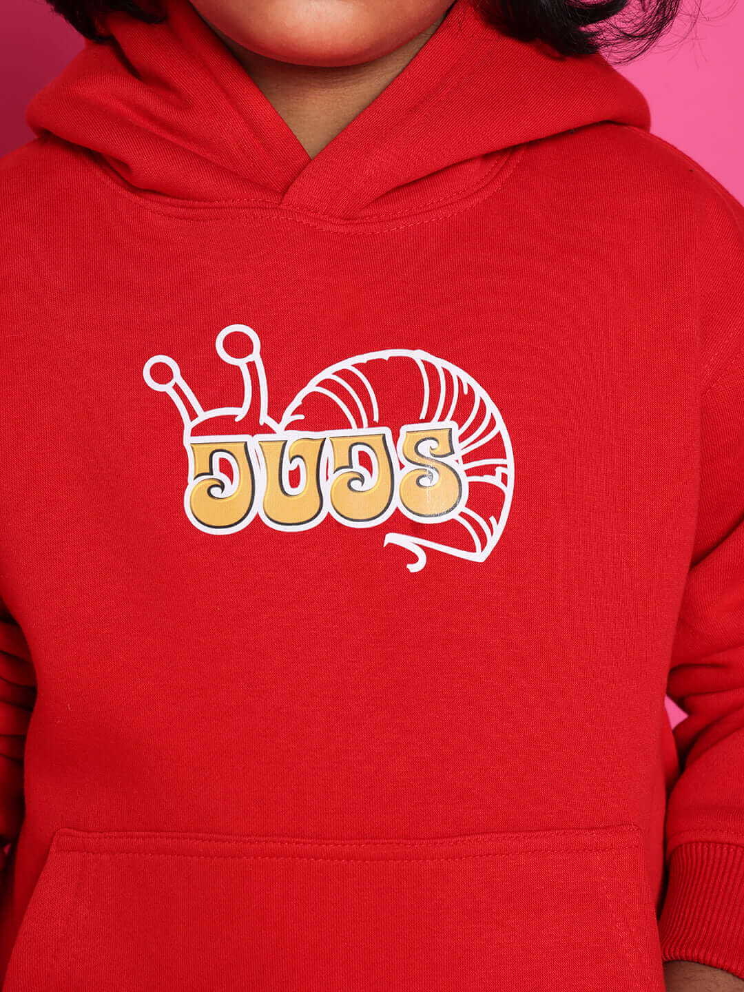 Child wearing red Snail Co-Ord for Boys Girls Red Black hoodie with snail logo in a close-up view.